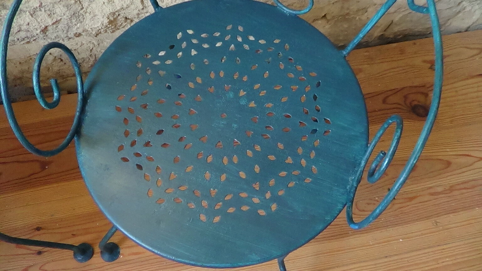 A pair of metal garden chairs