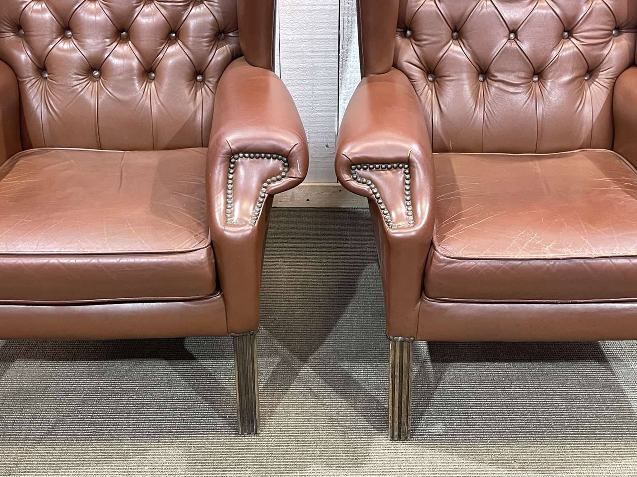 Pair of 1970s Chesterfield wingback chairs in brown leather