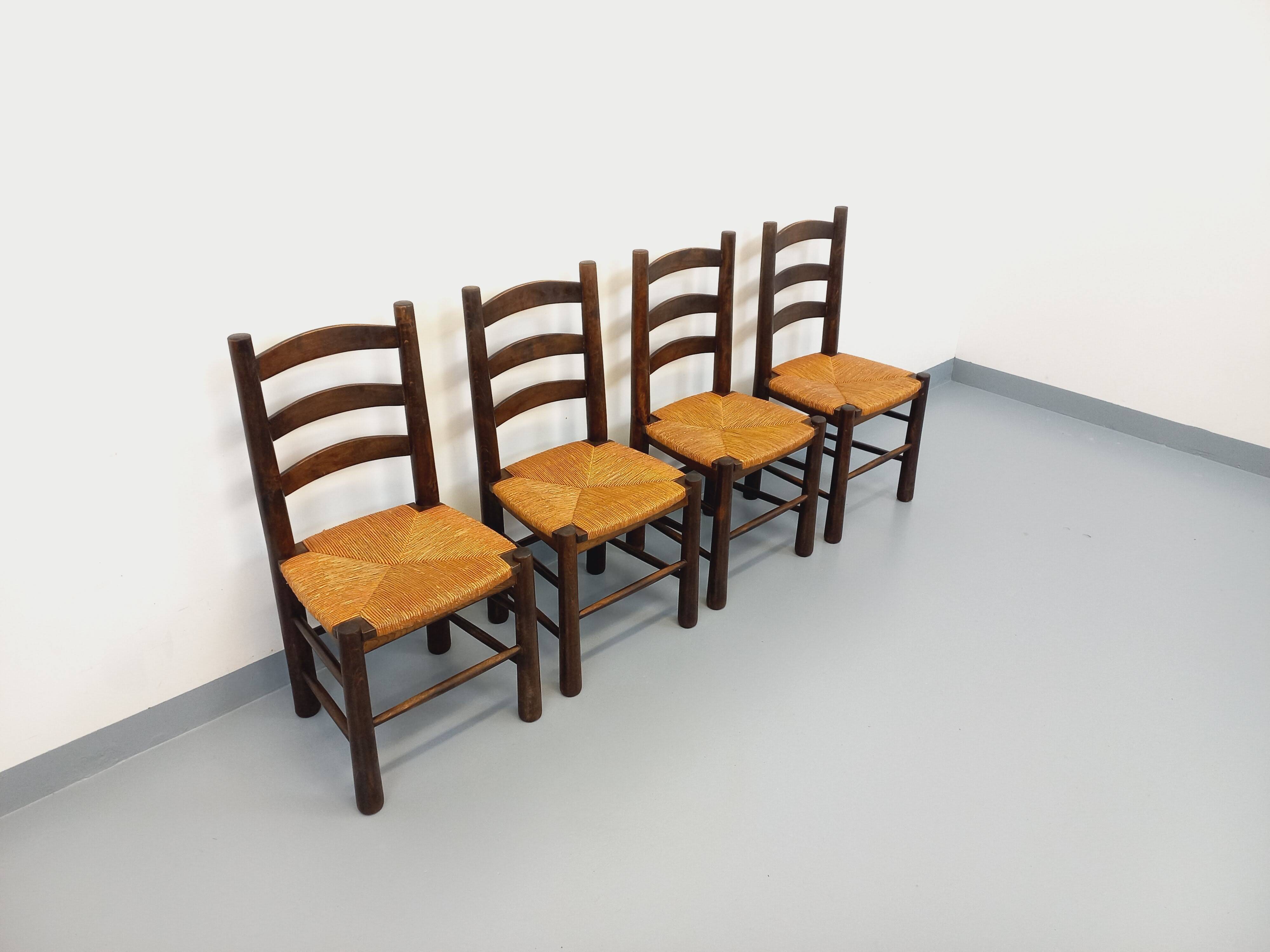 Set of 4 vintage brutalist chairs by Georges Robert in wood and straw.