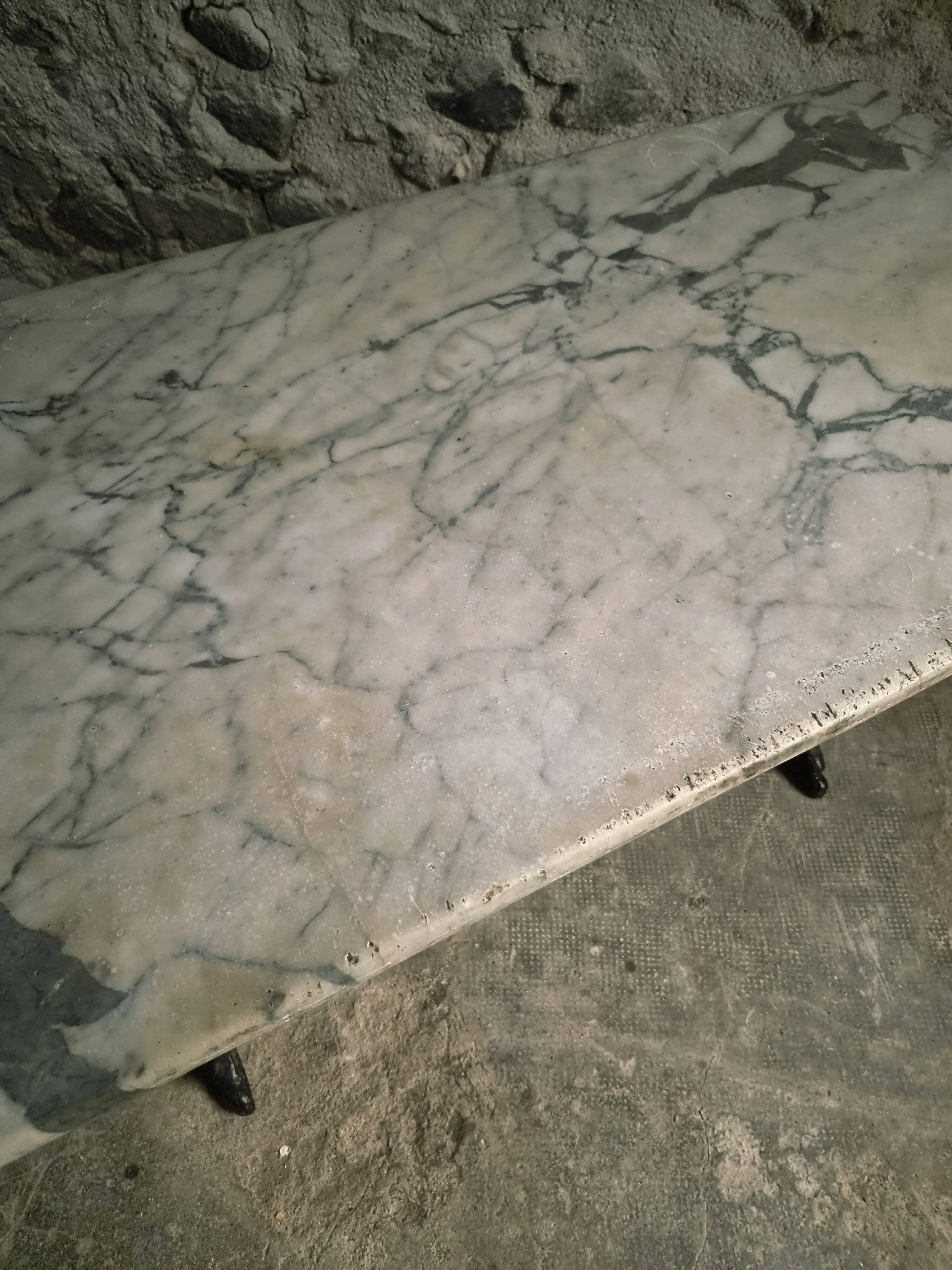 French bistro table made of marble with a cast iron base, 1920s–1930s.