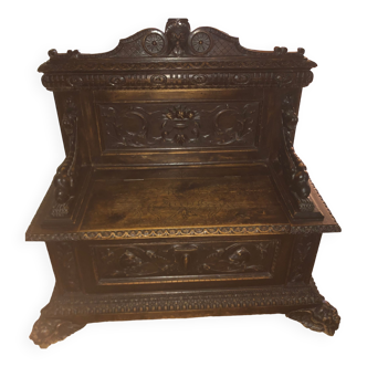 Solid wood chest, carved, with backrest, feet and armrests