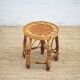 Vintage bamboo stool, woven rattan plant stand, interior decoration.