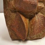 Ceramic relief portraying a lady. Emerging out of the background.