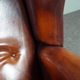 Patinated sheepskin armchair