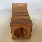 Six wooden egg cups and their Scandinavian style support