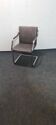 One of two vintage Leather and metal arm chairs.