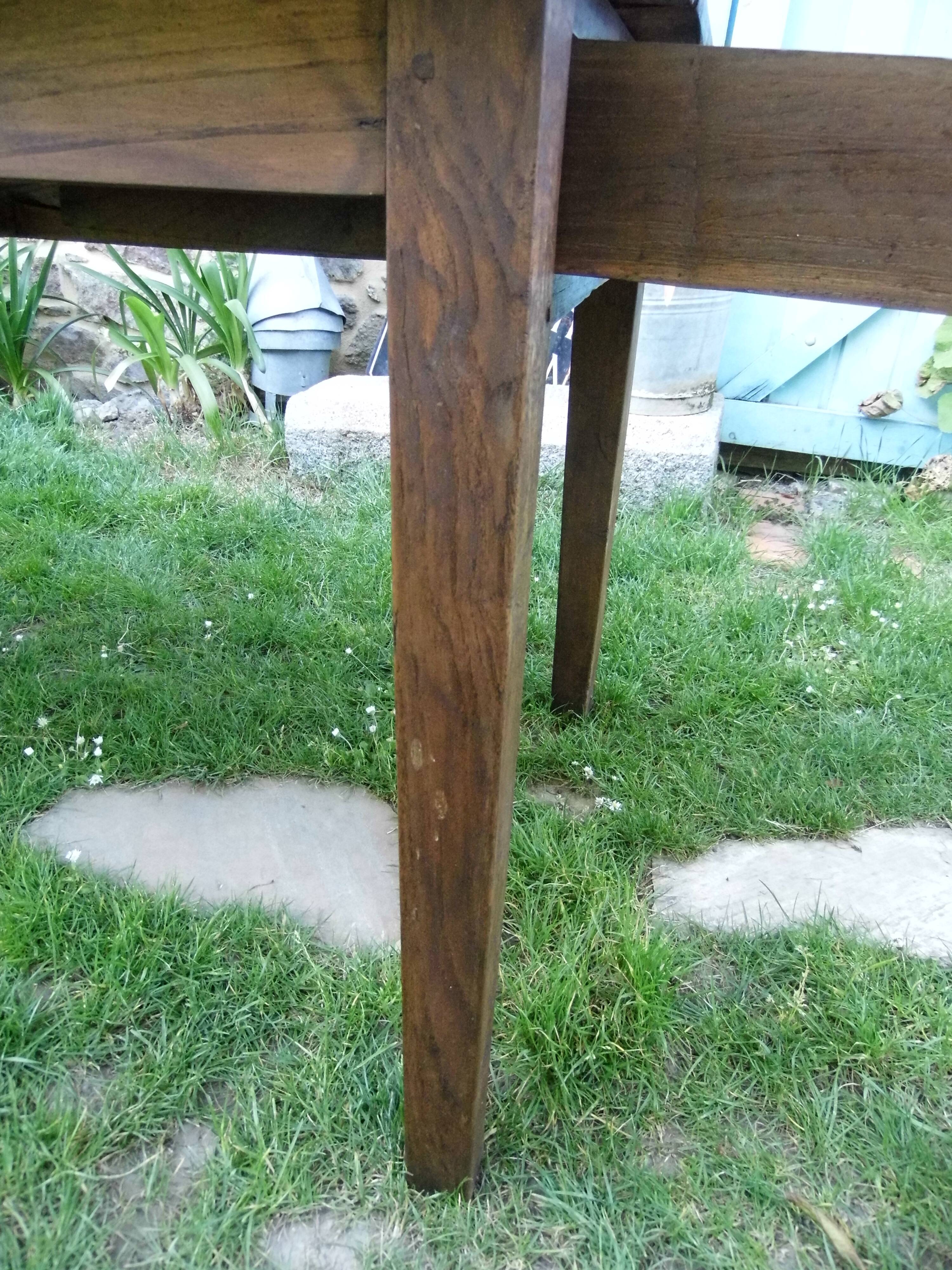 Farmhouse table and its two benches, chestnut, early 20th century