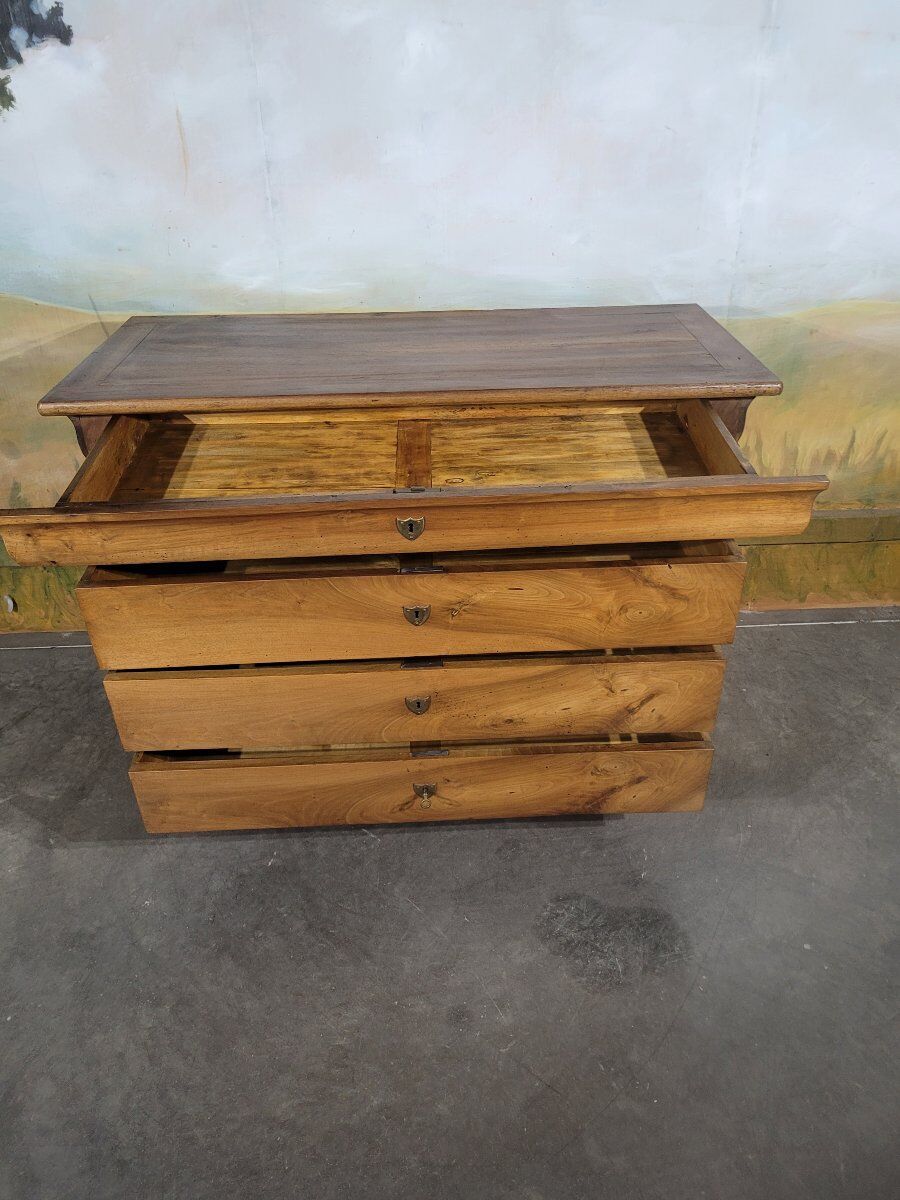Louis Philippe period chest of drawers in solid walnut.