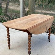 Louis Philippe oval table with shutters, 19th century, solid oak wood, twisted leg