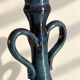 Decorative deep blue glazed ceramic vase with twin handles.