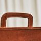 Trompe-l'Oeil magazine rack 'Actentasche' in patinated leather and canvas