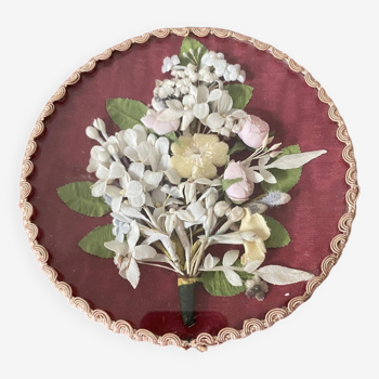 Round frame bouquet of flowers in fabric under non-curved glass