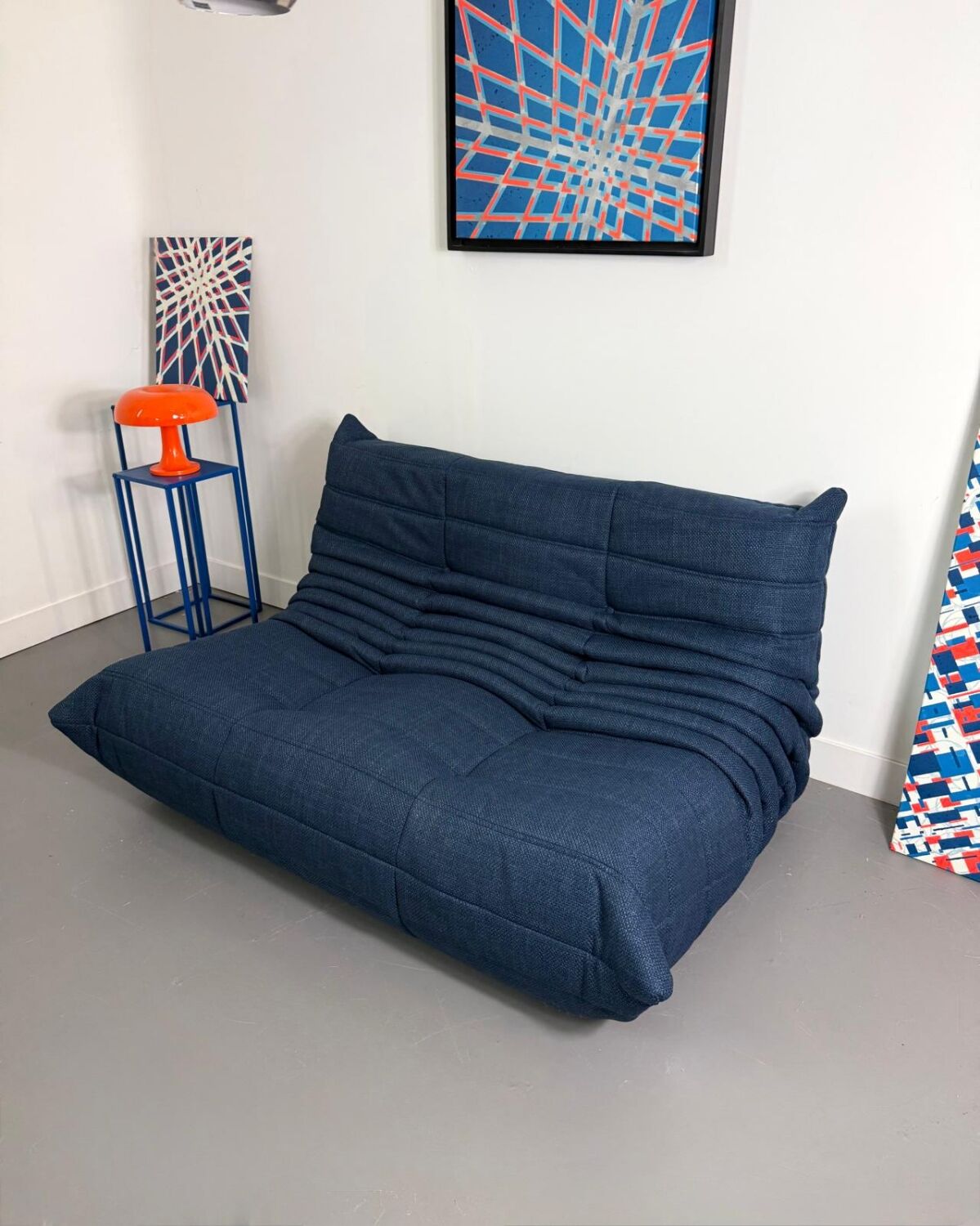 Two-seater sofa reupholstered.