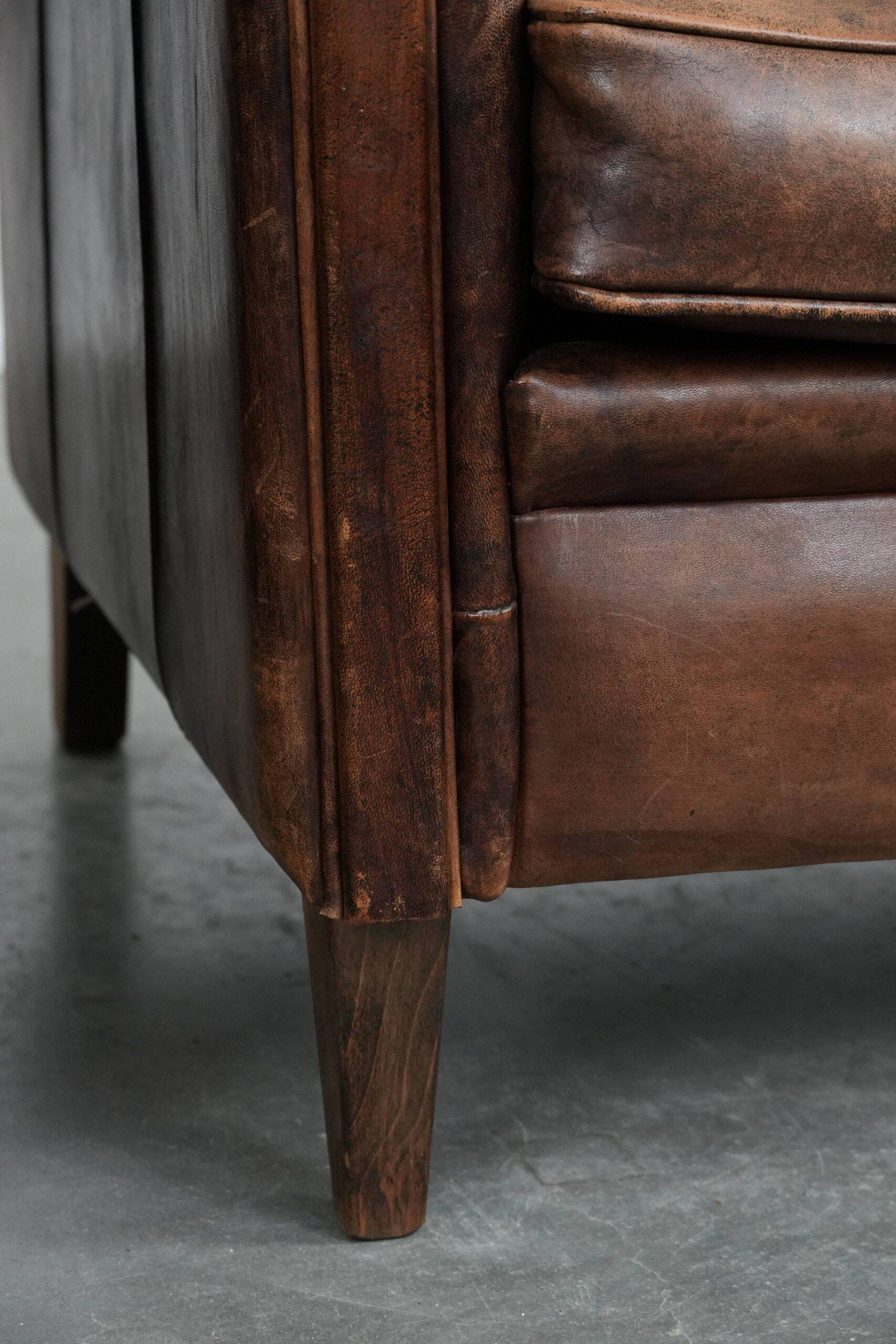 Set of 2 vintage sheepskin armchairs with a characterful appearance