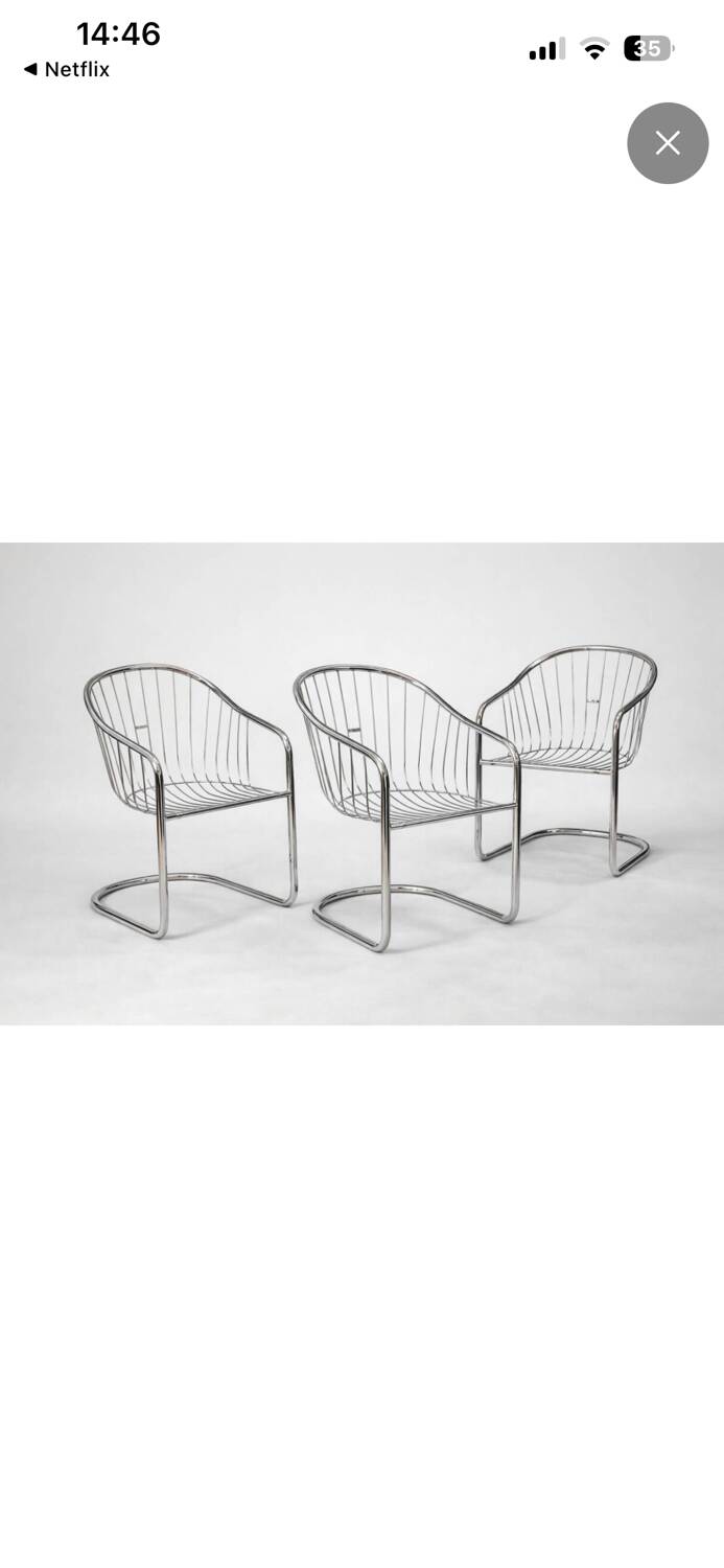 6 chrome metal chairs in the style of Gastonne Ronaldo.