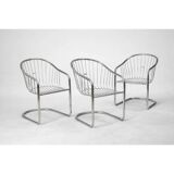 6 chrome metal chairs in the style of Gastonne Ronaldo.