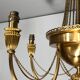 Neoclassical style brass chandelier decorated with pearl garlands