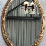 Old oval beveled golden mirror