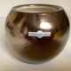 Small round vase, cracked golden ceramic.