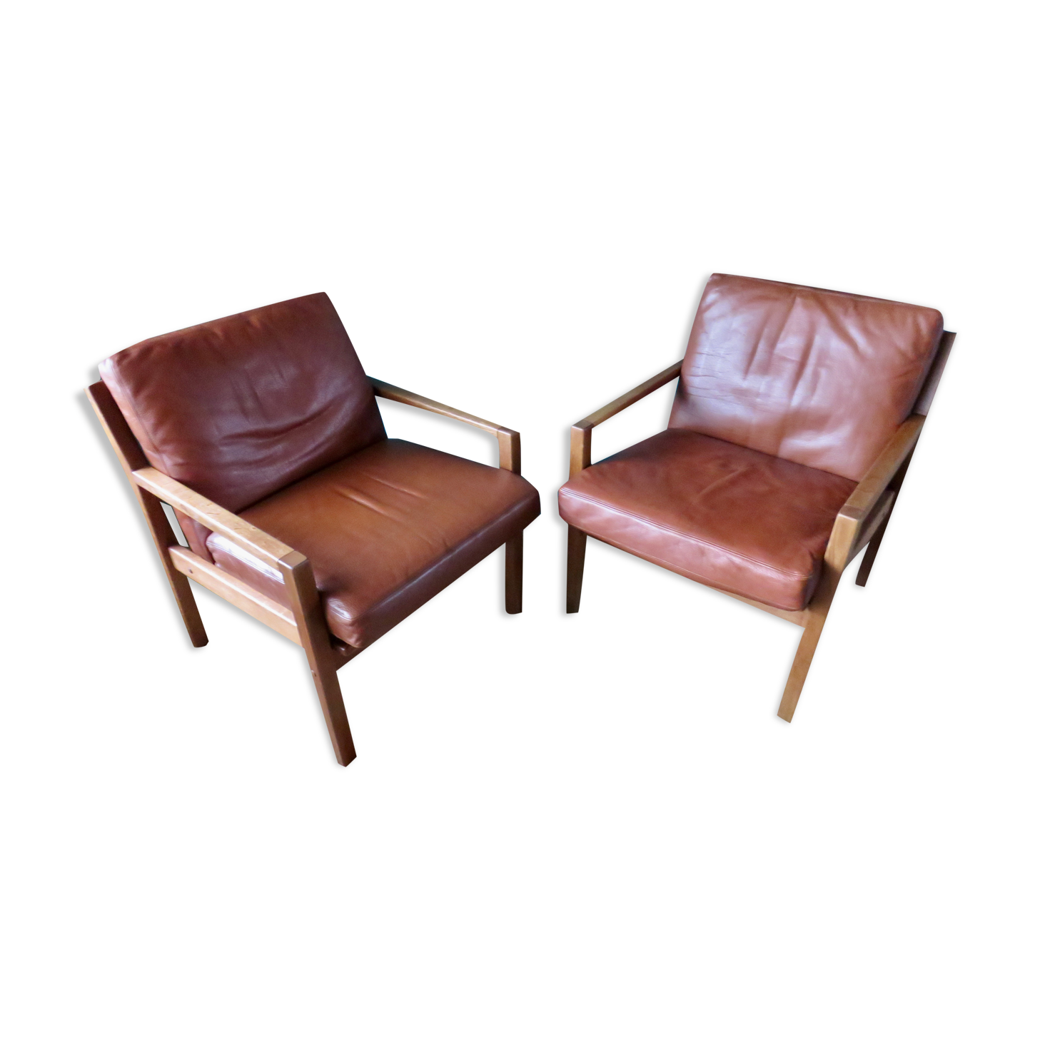 Pair of oak faults with tawny leather cushion. Denmark 1960