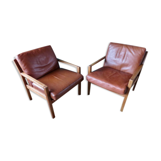 Pair of oak faults with tawny leather cushion. Denmark 1960