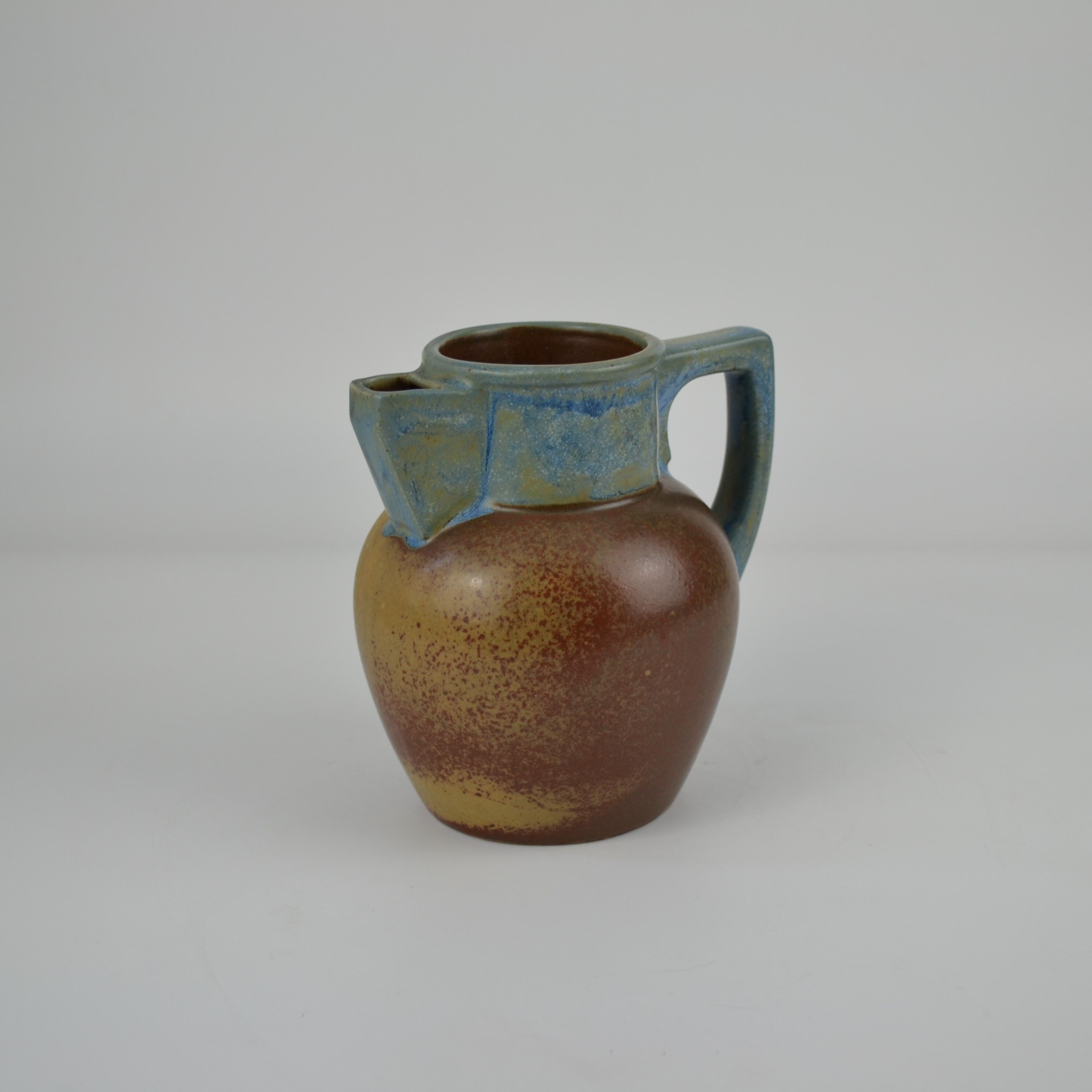Two-tone stoneware pitcher by Louis Lourioux