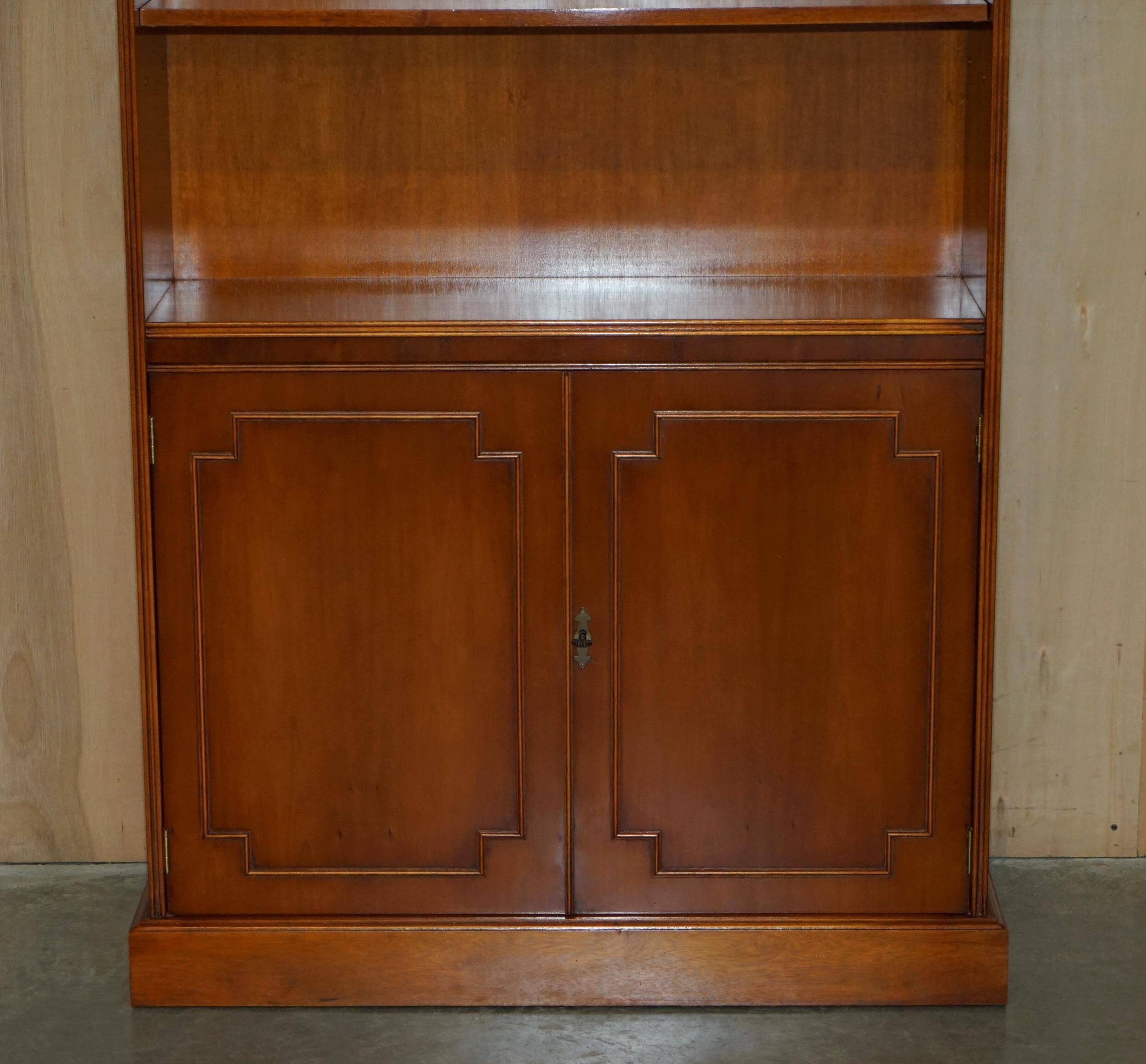 Open library Bradley Furniture made of yew wood with a cupboard base.