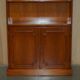 Open library Bradley Furniture made of yew wood with a cupboard base.