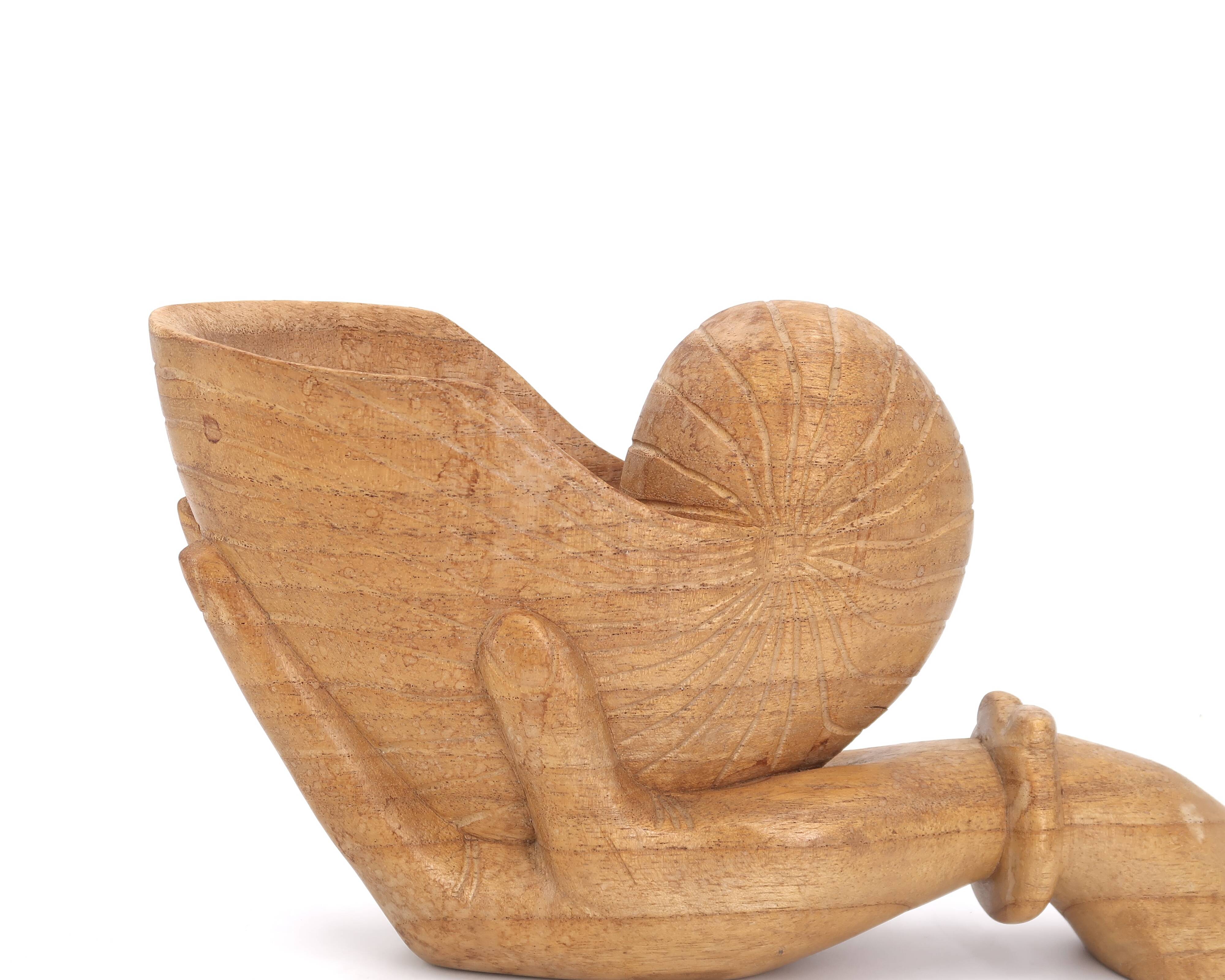 Wooden hand emptier holding a shell, 1970s