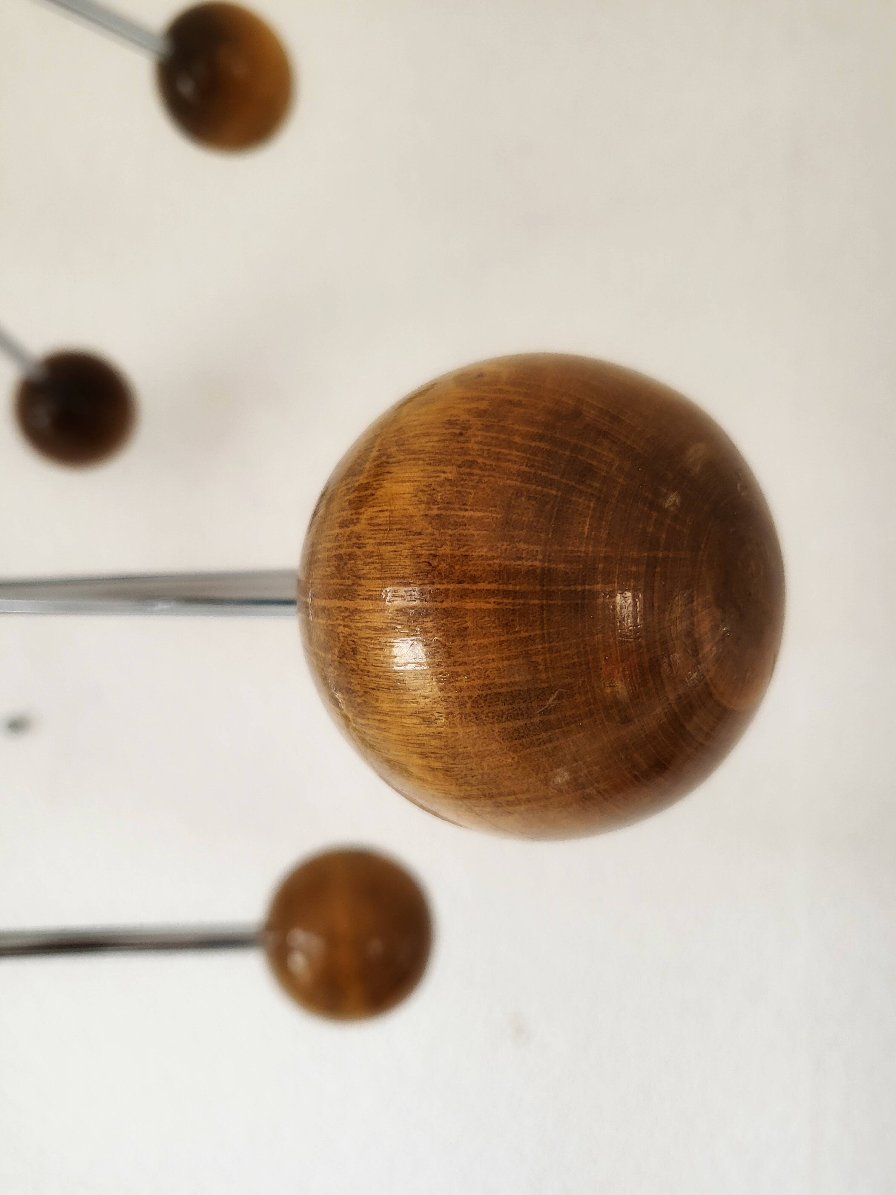 Atomic Coat rack in chrome/black metal and wood.