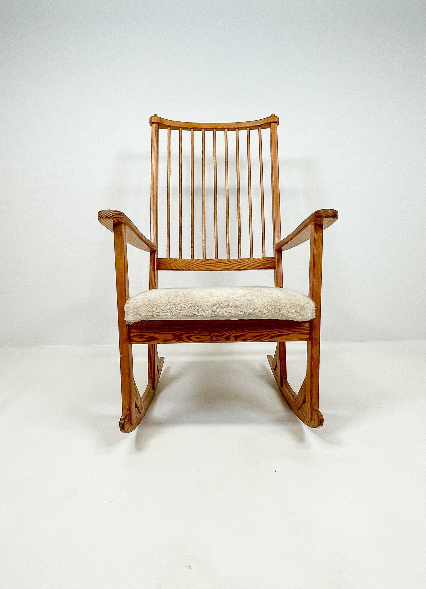 Mid-century rocking chair in pine and sheepskin by Yngve Ekström, Sweden.