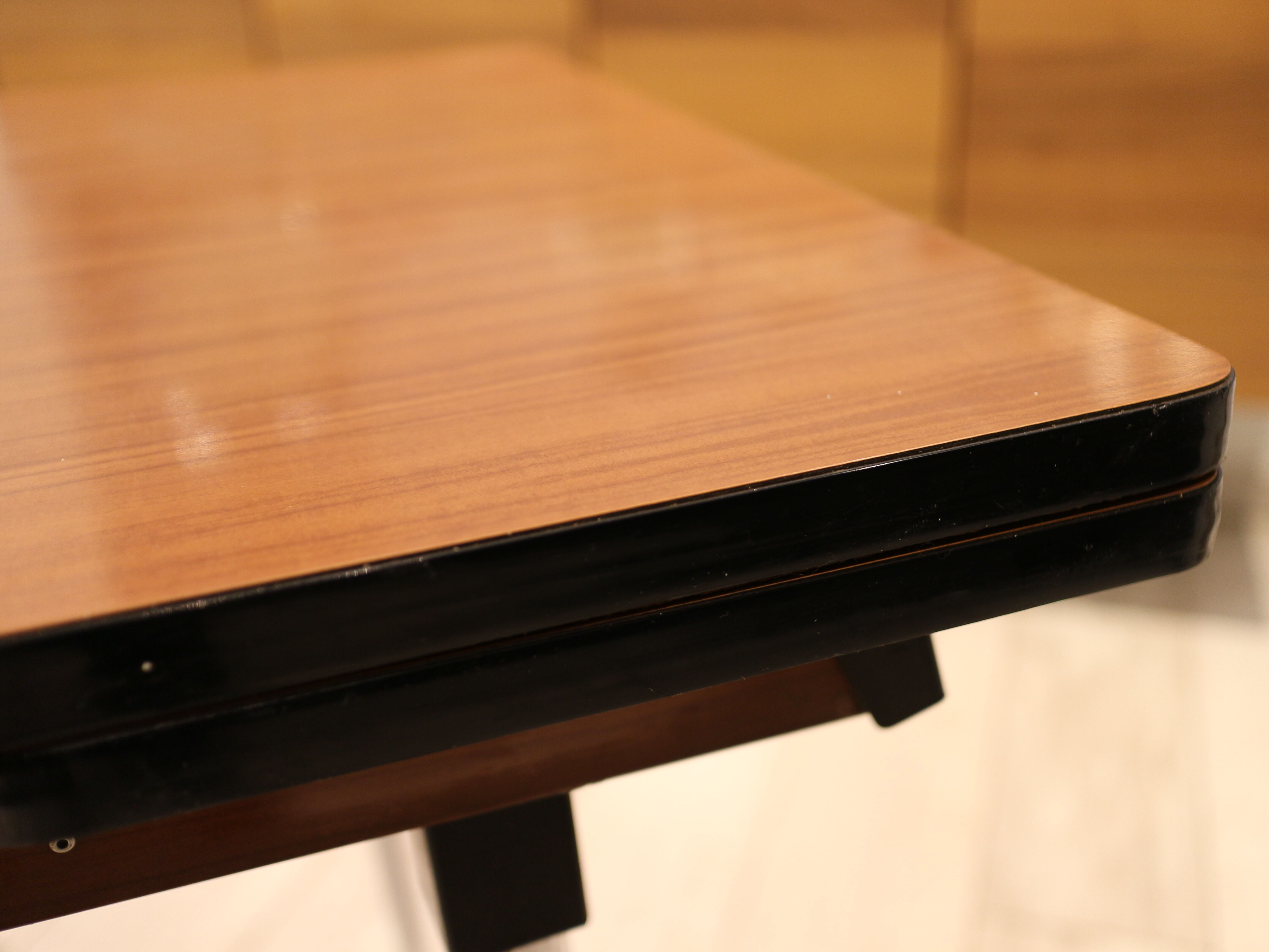 Briwn Formica table with extension cords and drawer