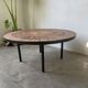 Capron “herbarium” coffee table with metal base