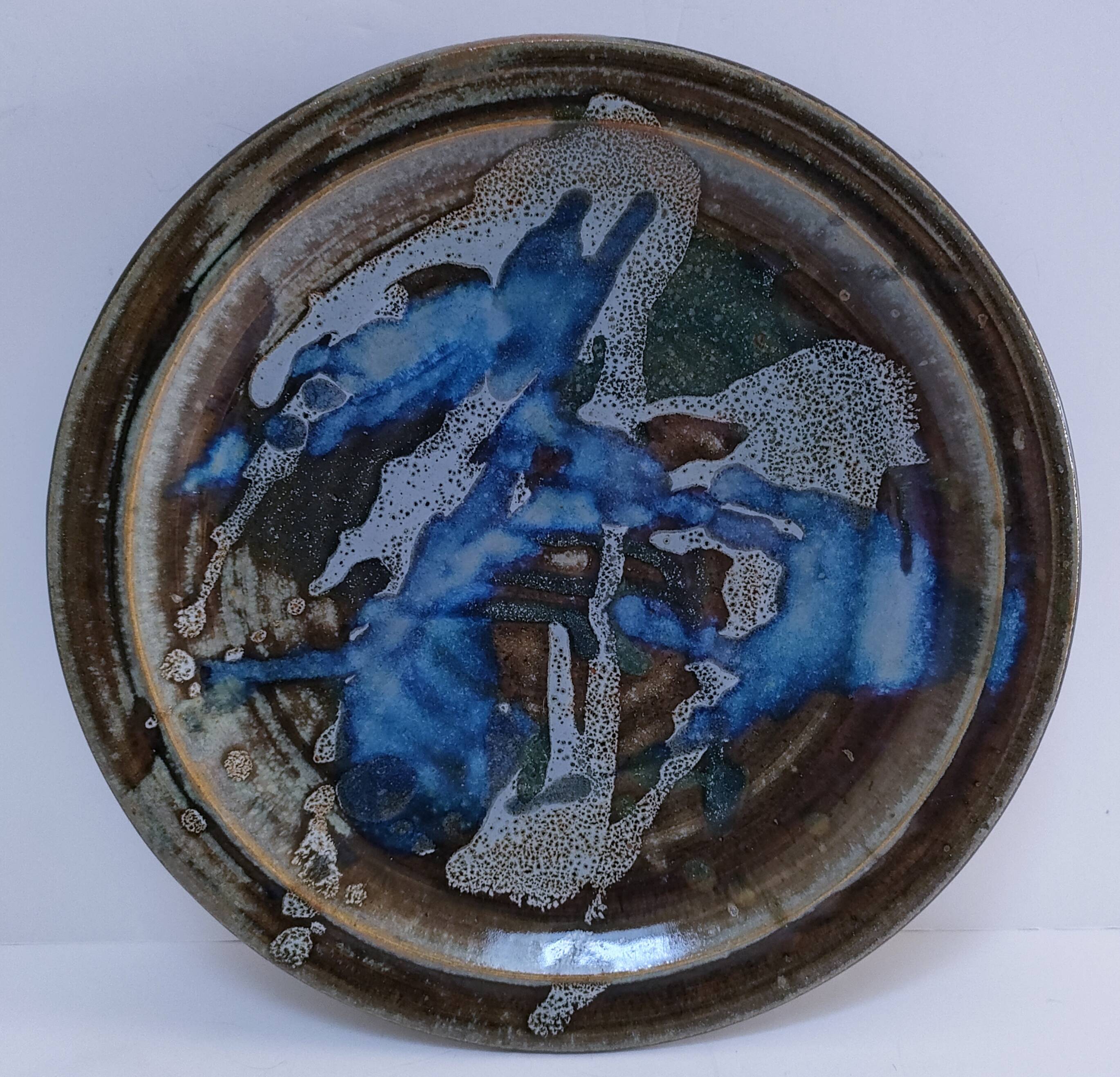 large enamelled stoneware plate signed mcb la borne