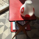 Double-footed red Formica wood spindles console