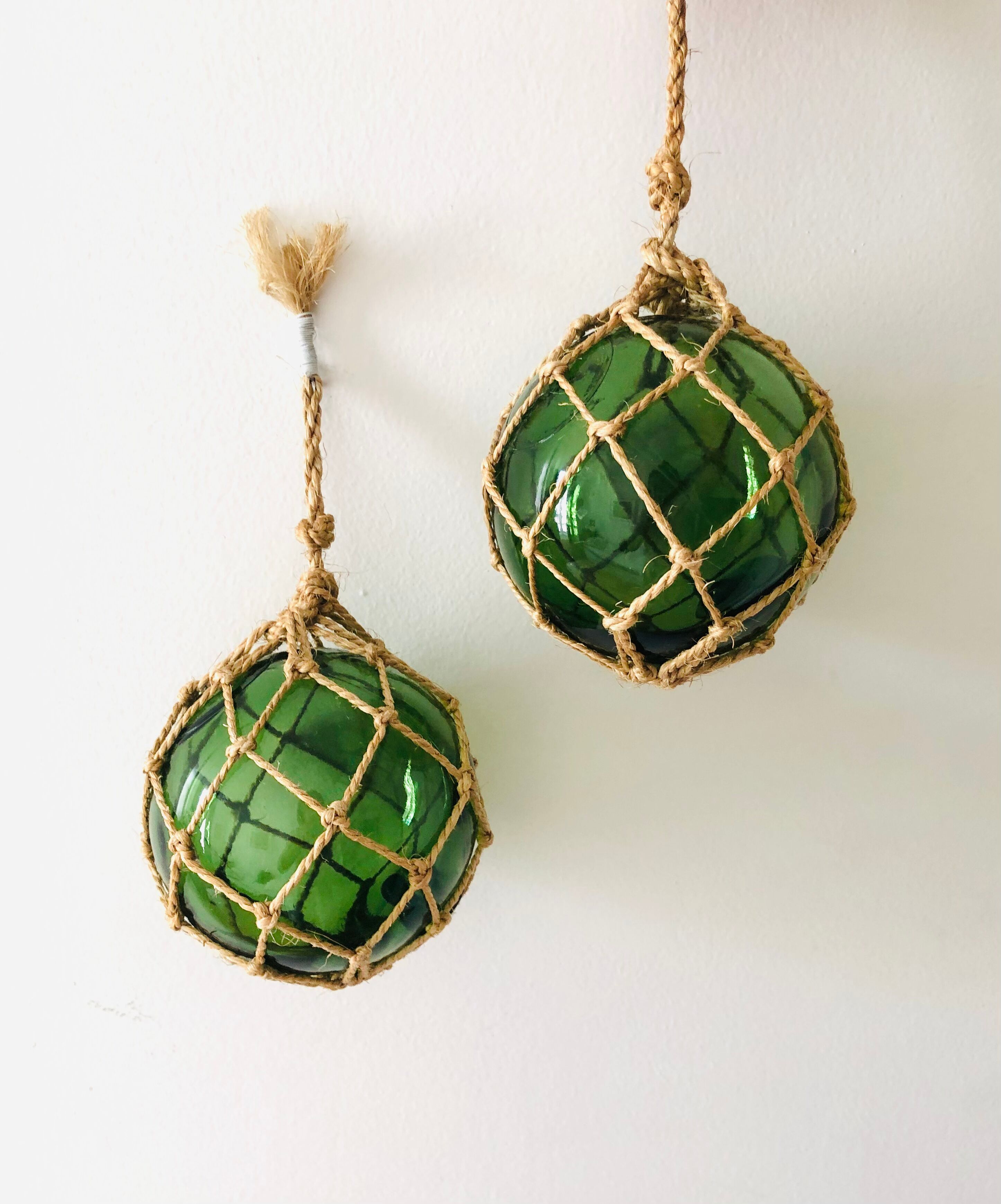 Pair of fishing floats and glass and rope