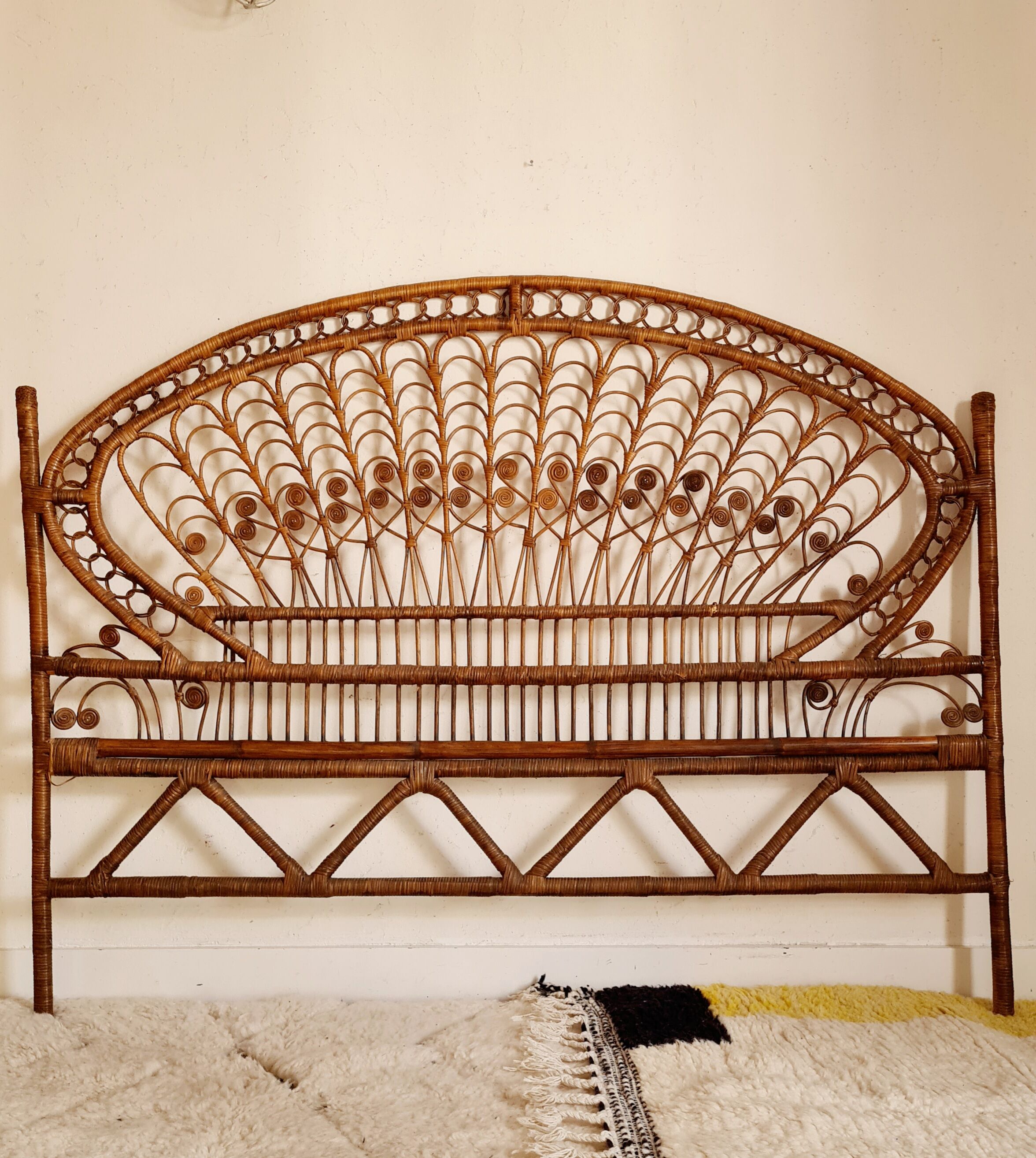 Peacock headboard in vintage rattan