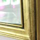 Rectangular gold mirror with bevelled glass.