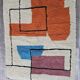 Traditional handmade wool Berber rug with colourful patterns.