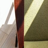 Vintage armchair in moss green bouclé design by H. Lis.