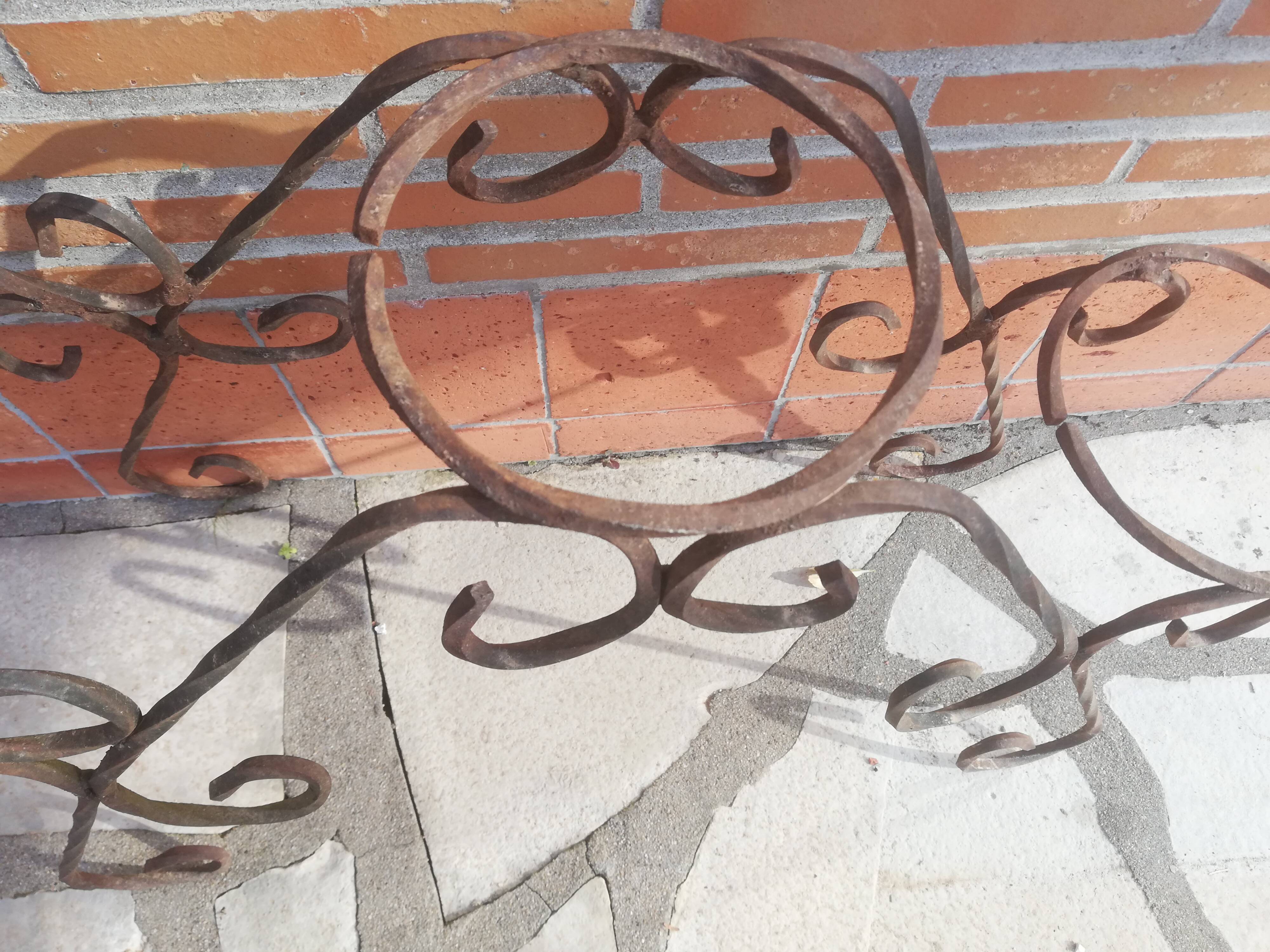 Wrought iron plant holders