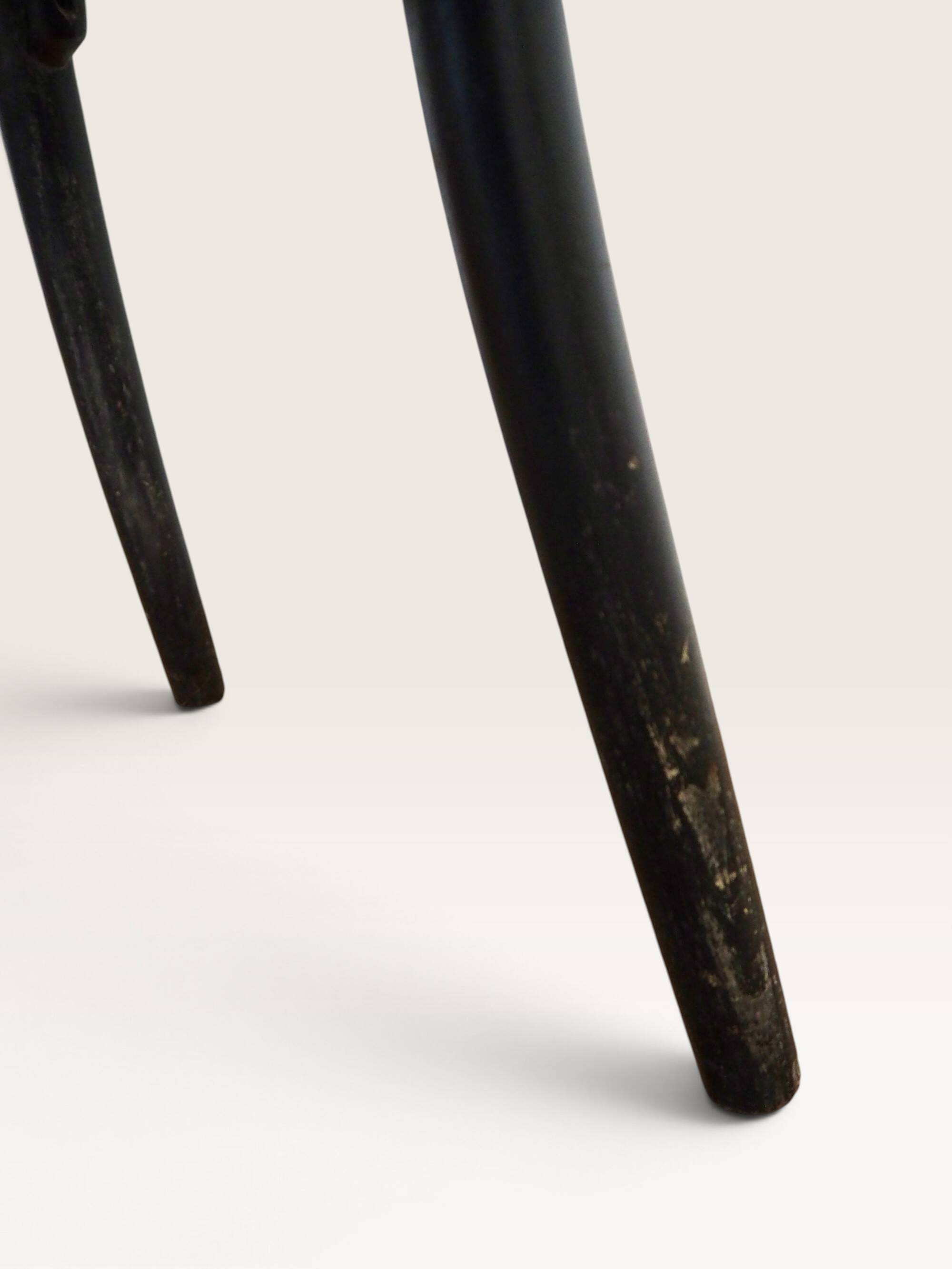 Curved black lacquered wooden armchair in Thonet style