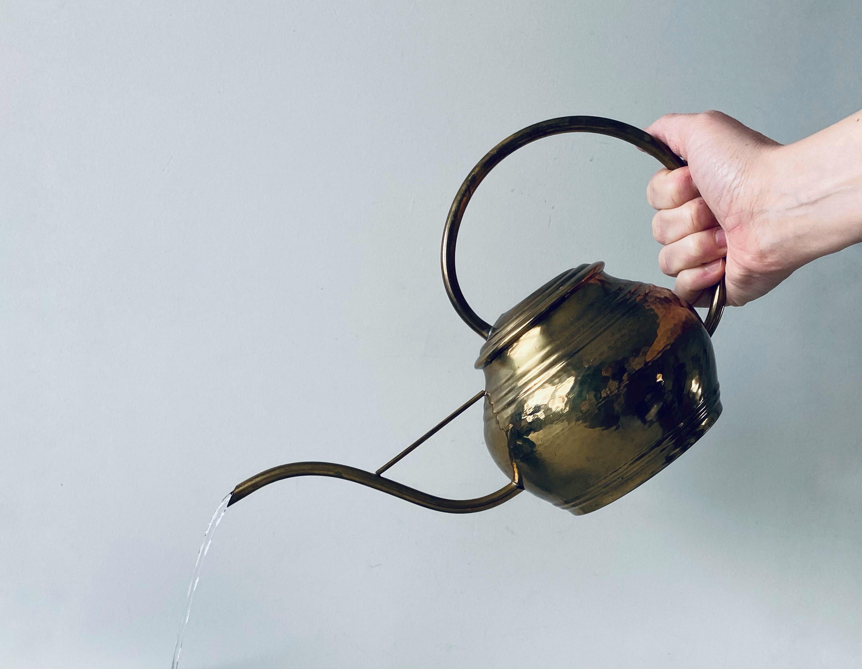 Old brass watering can