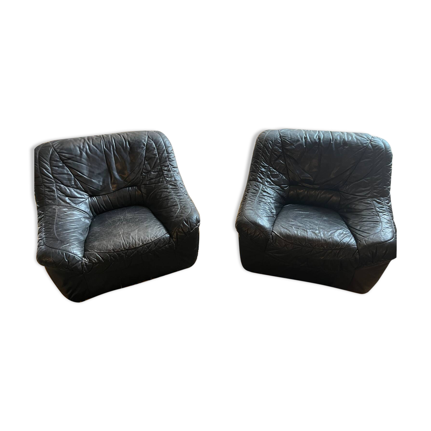 Pair of black leather armchairs from the 80s