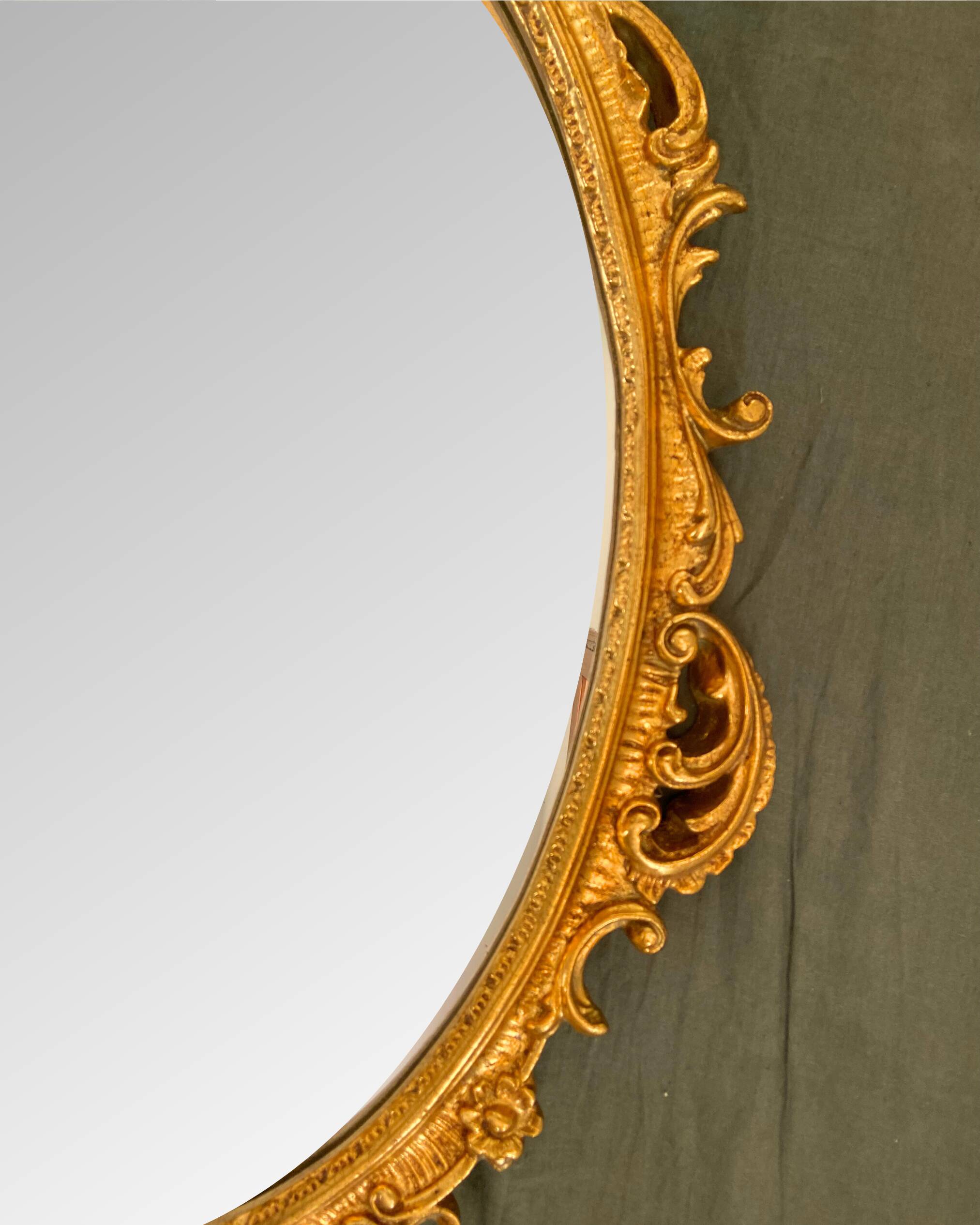 Beautiful Baroque Style Oval Decorative Mirror - Gilded with gold leaf with a Beautiful Patina