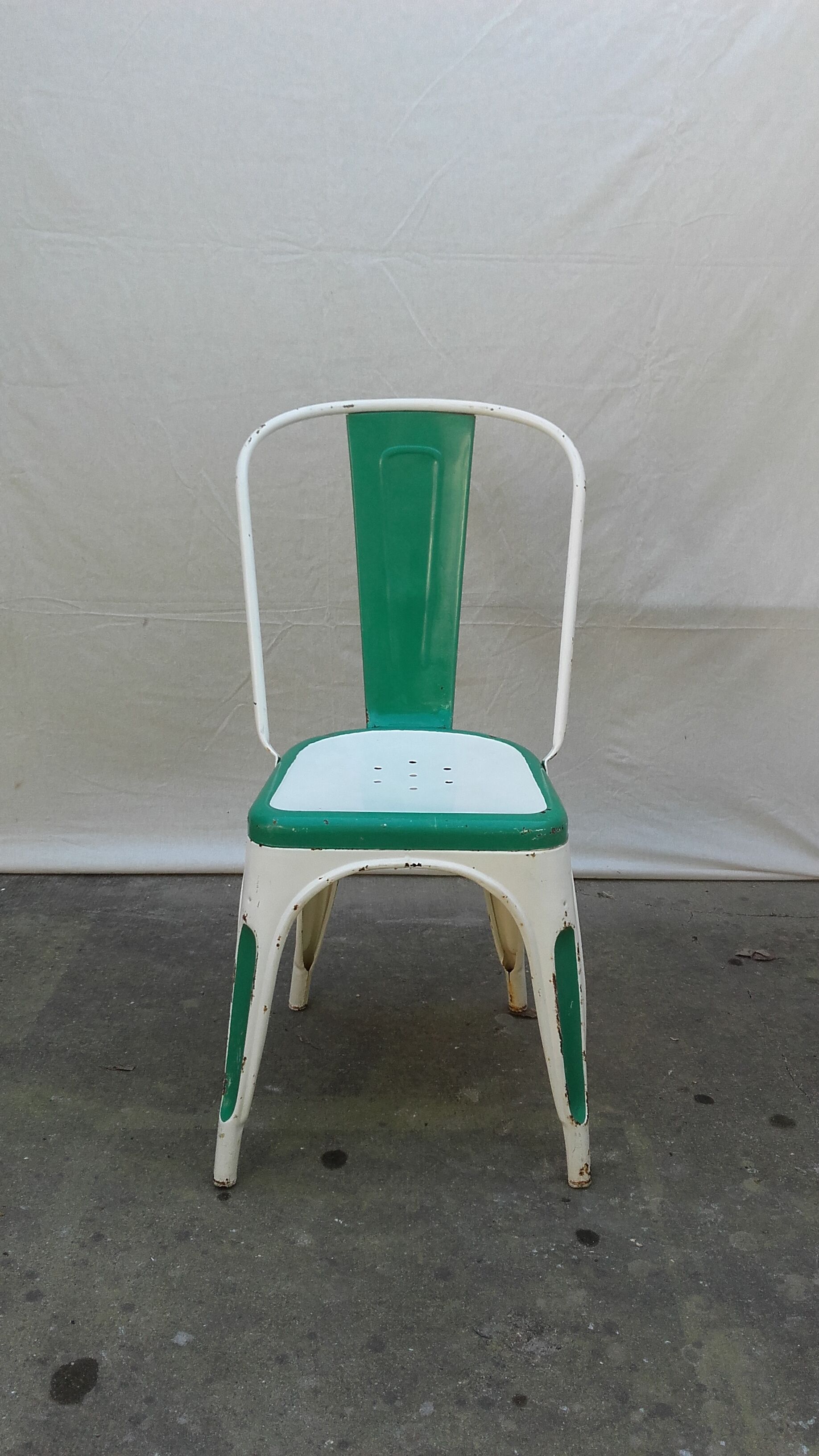 Four old Tolix Model A chairs