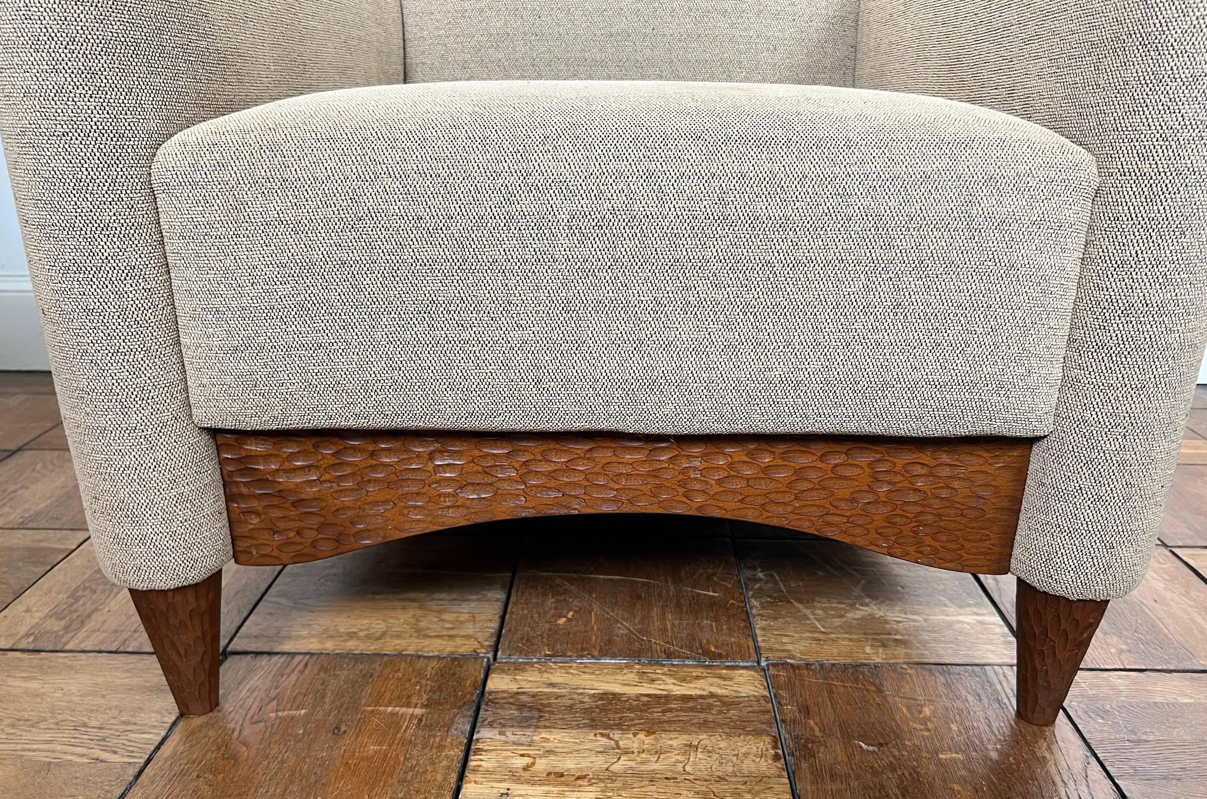 Pair of armchairs in carved wood and vintage fabric