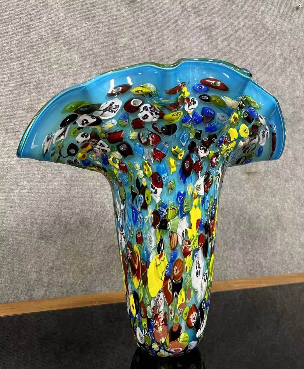 Venice circa 1980: Large "octopusy" vase in millefiori glass with a blue background