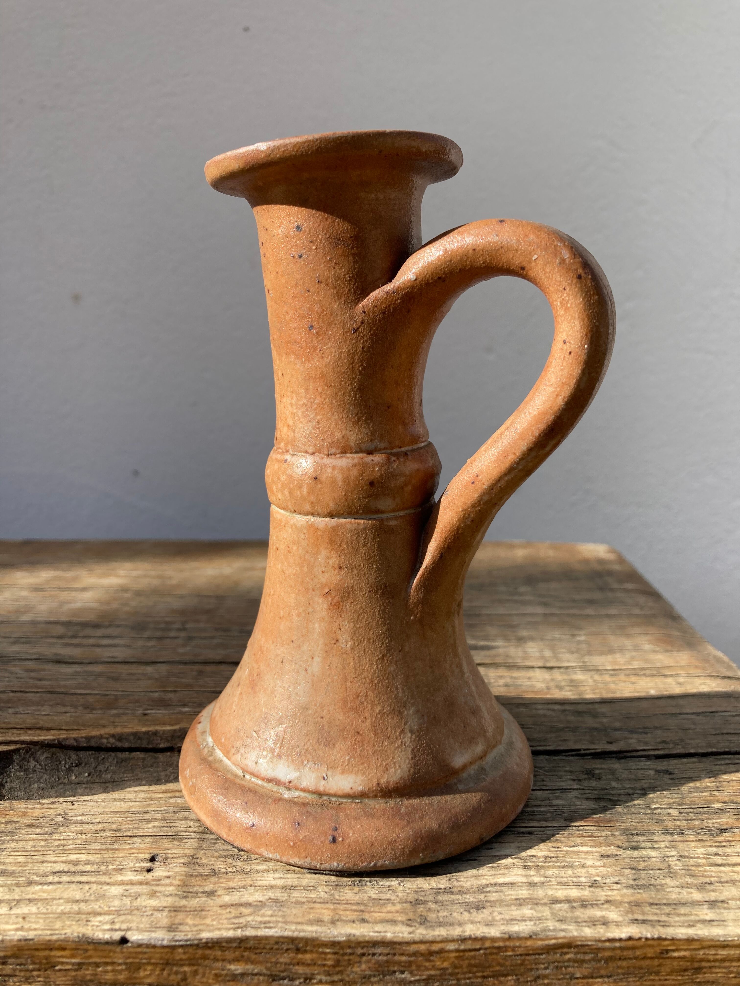 Candle holder in beige brown enamelled sandstone