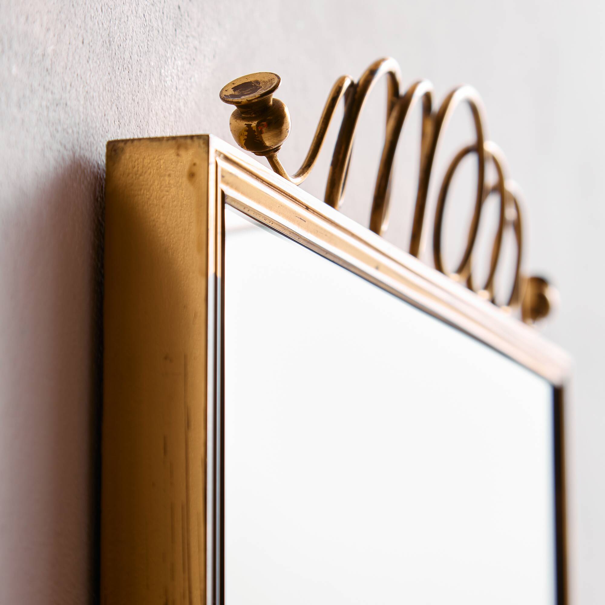 Metal and brass framed mirror